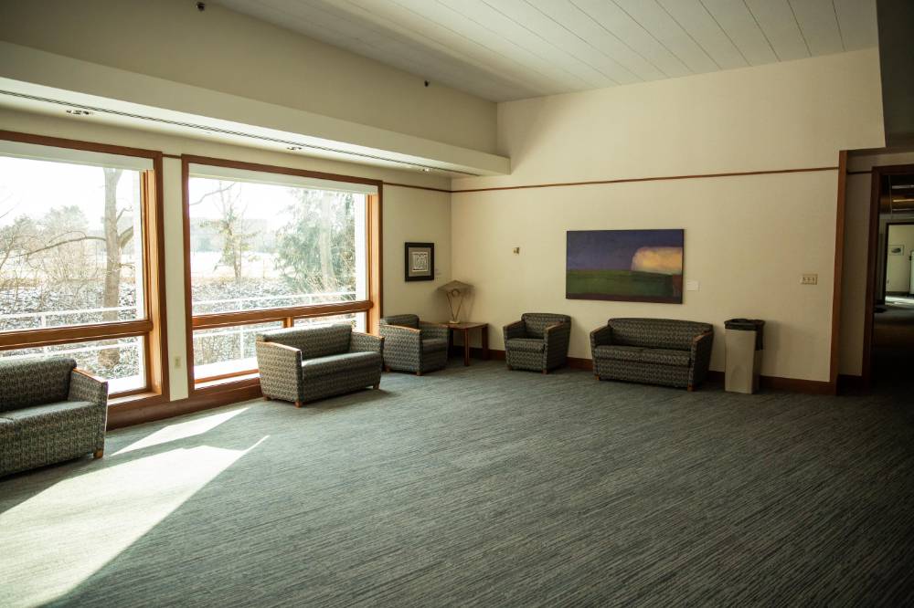 The lounge of the Cook-DeWitt Center facing the outside window.